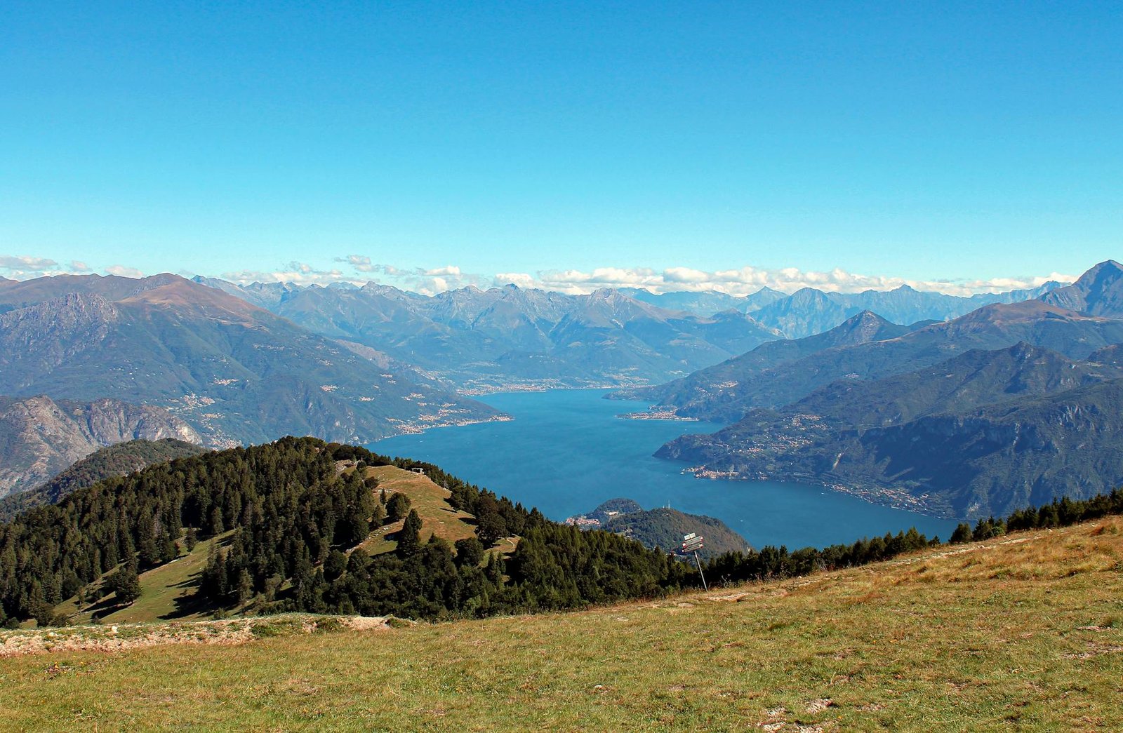 A stunning summer view of Lake Como surrounded by mountains from Monte San Primo.