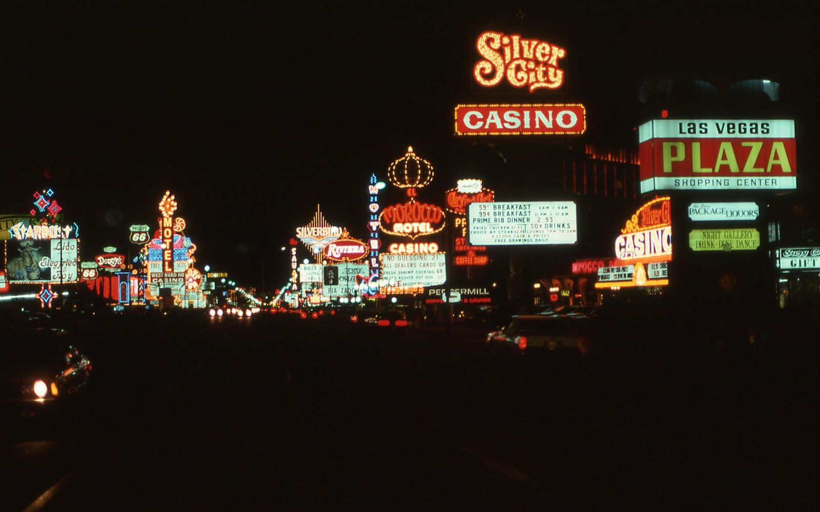 Capture the vibrant neon nightlife of vintage Las Vegas with iconic casinos and signs illuminating the cityscape.