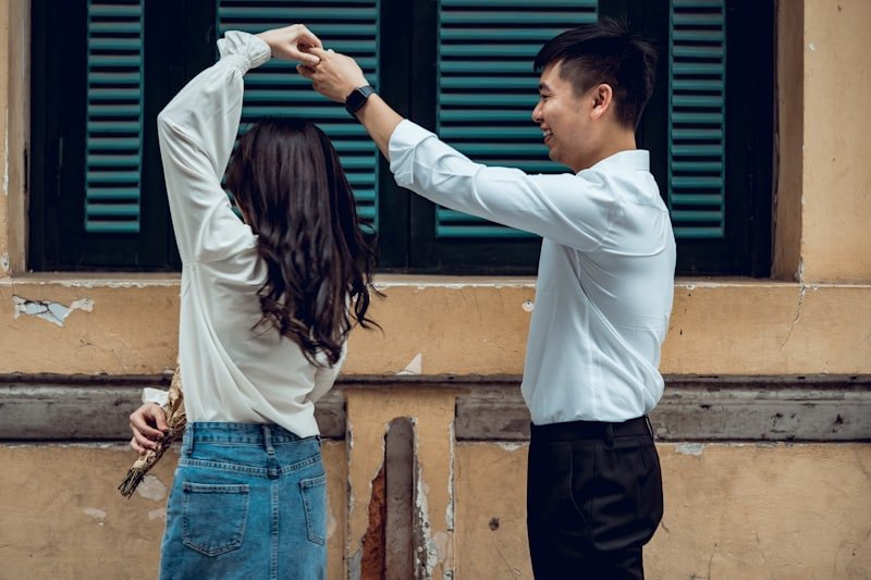 a man and a woman holding hands
