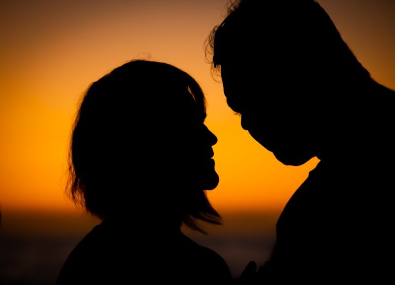 silhouette of 2 person during sunset