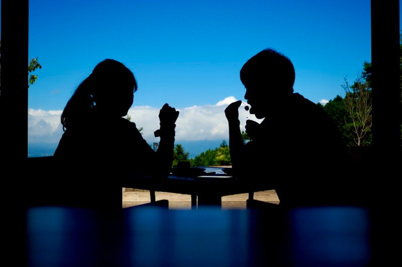 a man and a woman sitting at a table