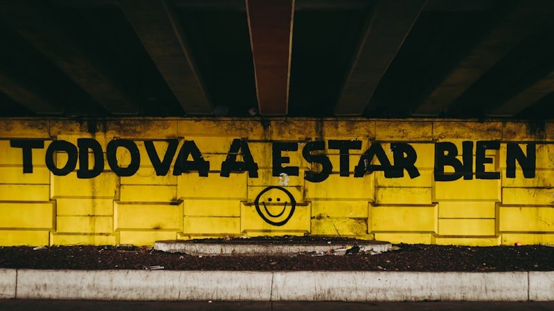 a yellow wall with a smiley face painted on it