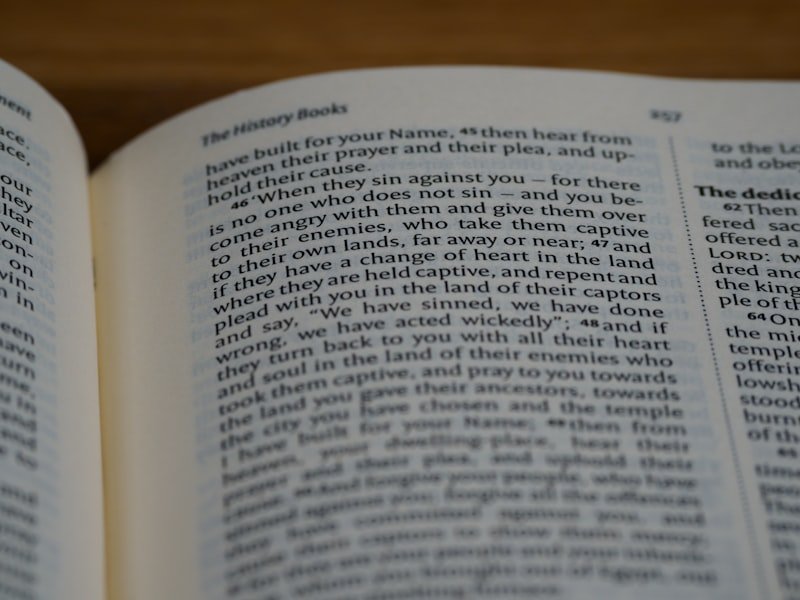 white book page on brown wooden table