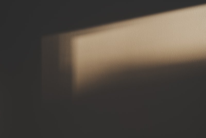 the shadow of a window on a wall