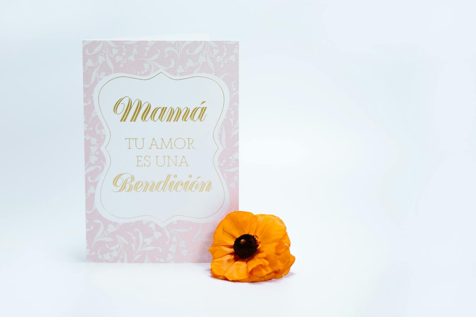 Chic Mother's Day card with 'Love is a blessing' text and a vibrant yellow flower.