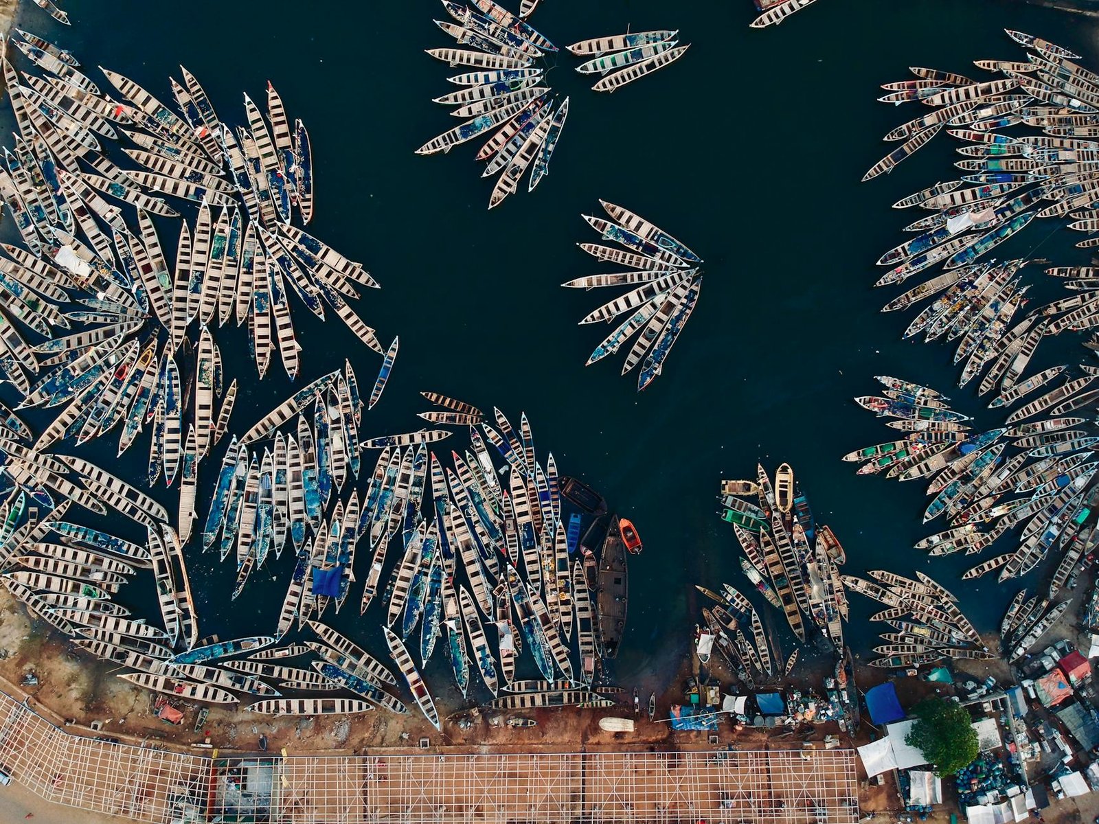 Top view of numerous fishing boats docked at Tema fishing harbour in Ghana.