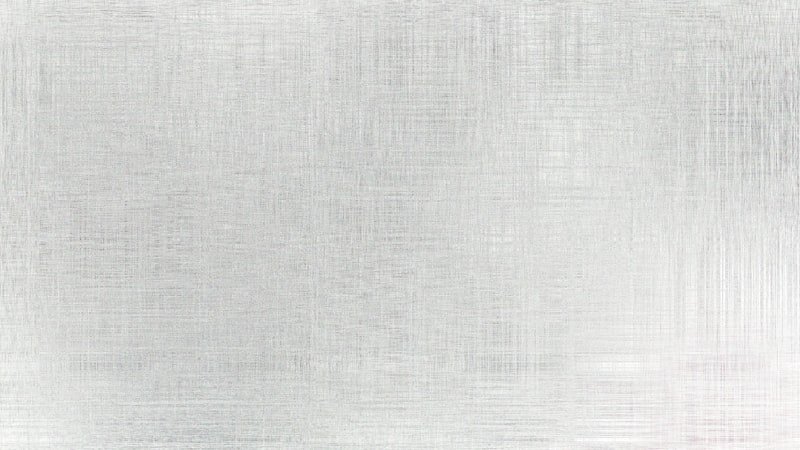 A brushed metal surface with subtle texture.