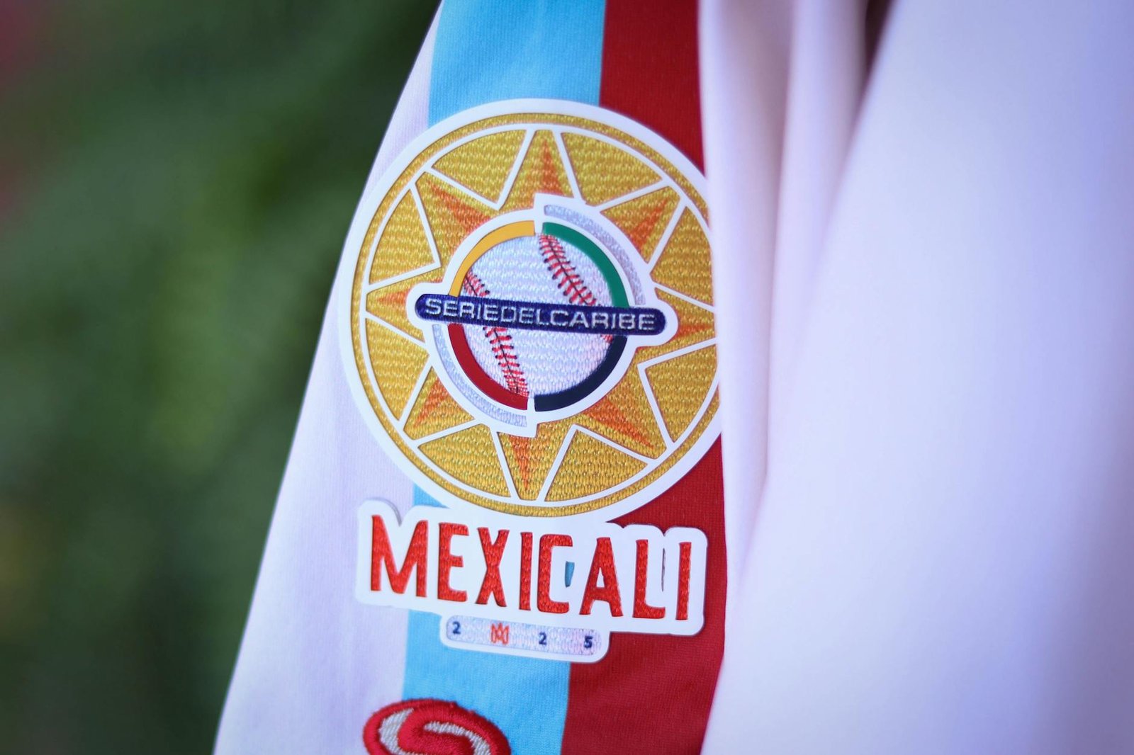 Close-up of Serie del Caribe Mexicali baseball patch on a white jacket sleeve.